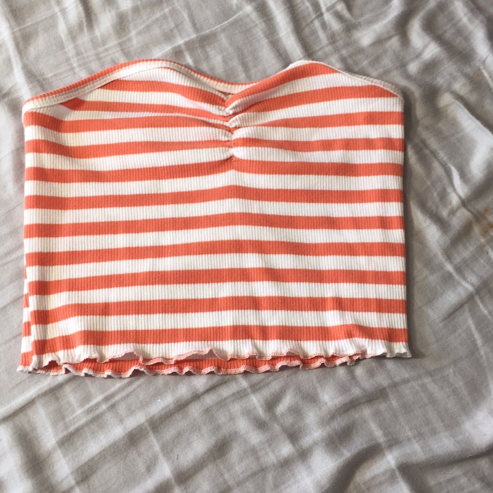 I am selling a white and salmon pink tube top.